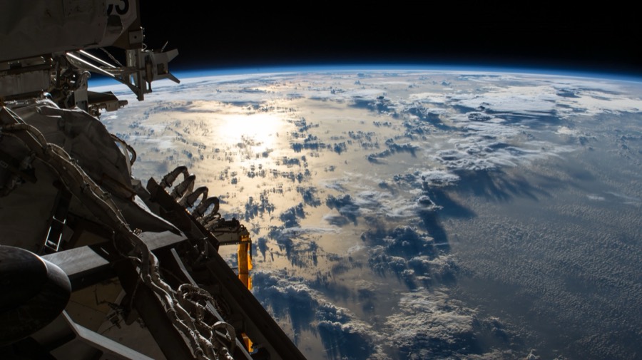 View of Earth from low-Earth orbit with Pacific Ocean and cloud systems